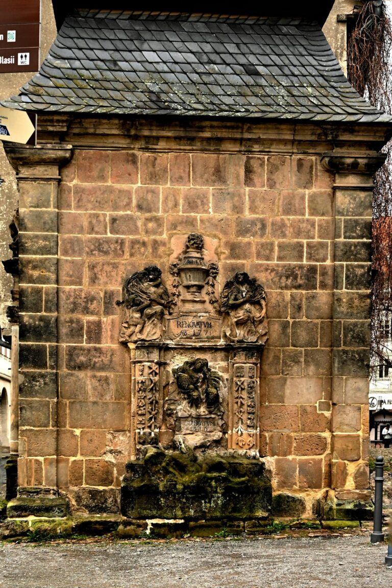 Intricate stone monument detail in Quedlinburg, highlighting rich history and architectural artistry.