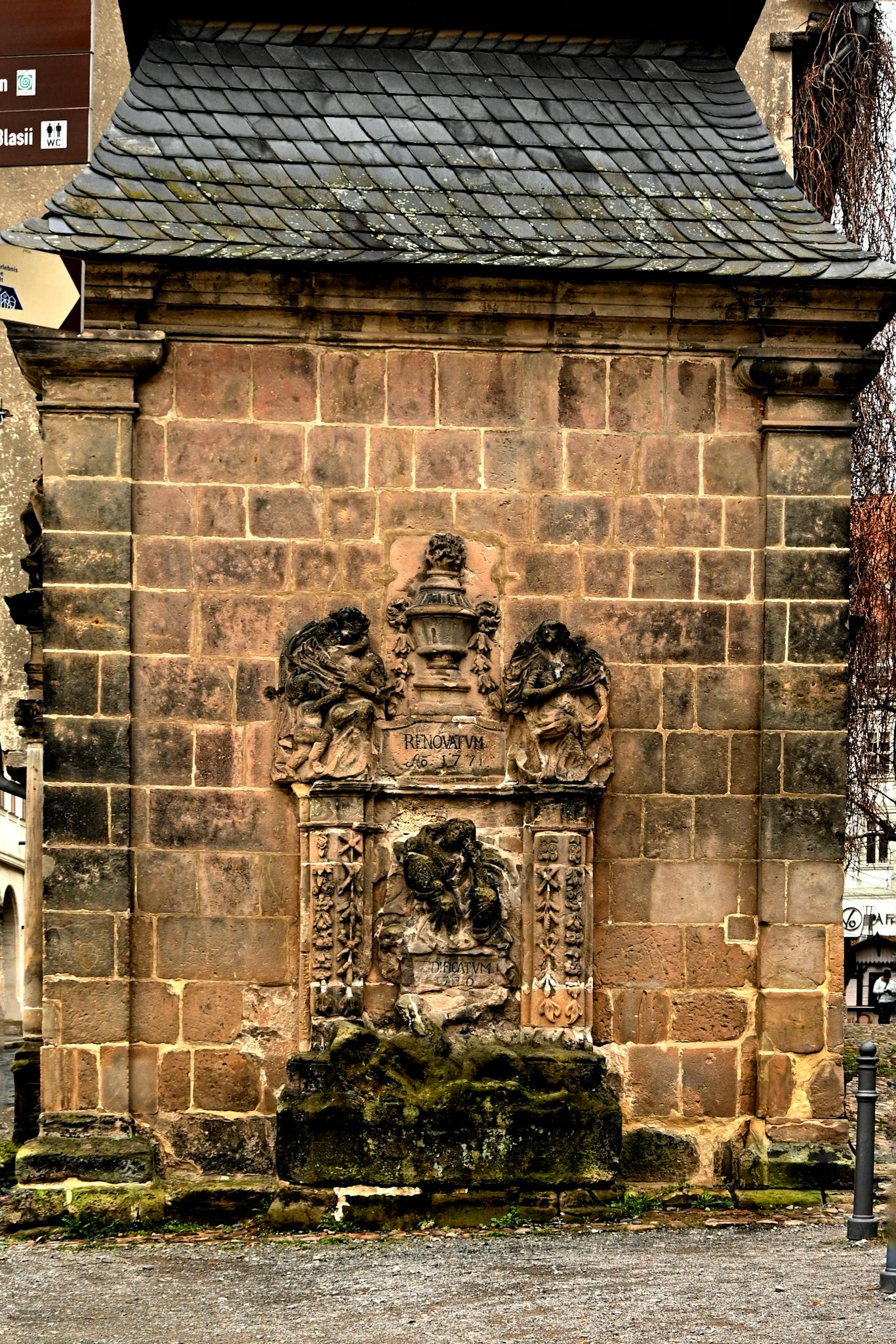 Intricate stone monument detail in Quedlinburg, highlighting rich history and architectural artistry.